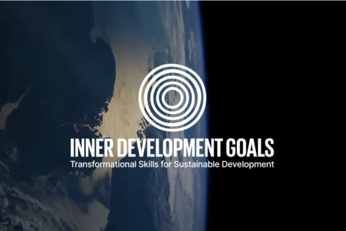 A view of Earth from space with a dark background, featuring the logo of Inner Development Goals. The logo consists of concentric circles above the text 'Inner Development Goals: Transformational Skills for Sustainable Development' in white.